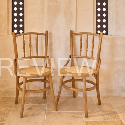 Desa Round Carved Teak Dining Chair with Woven Rattan Seat Panel