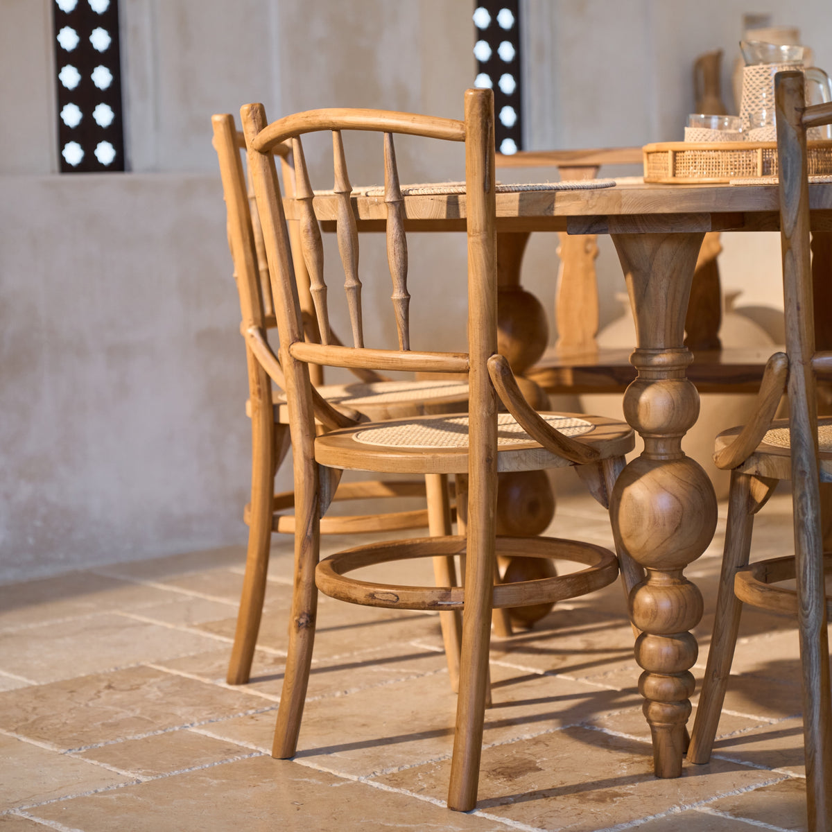 Desa Round Carved Teak Dining Chair with Woven Rattan Seat Panel